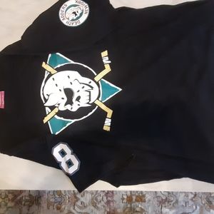 A black graphic short sleeved shirt.